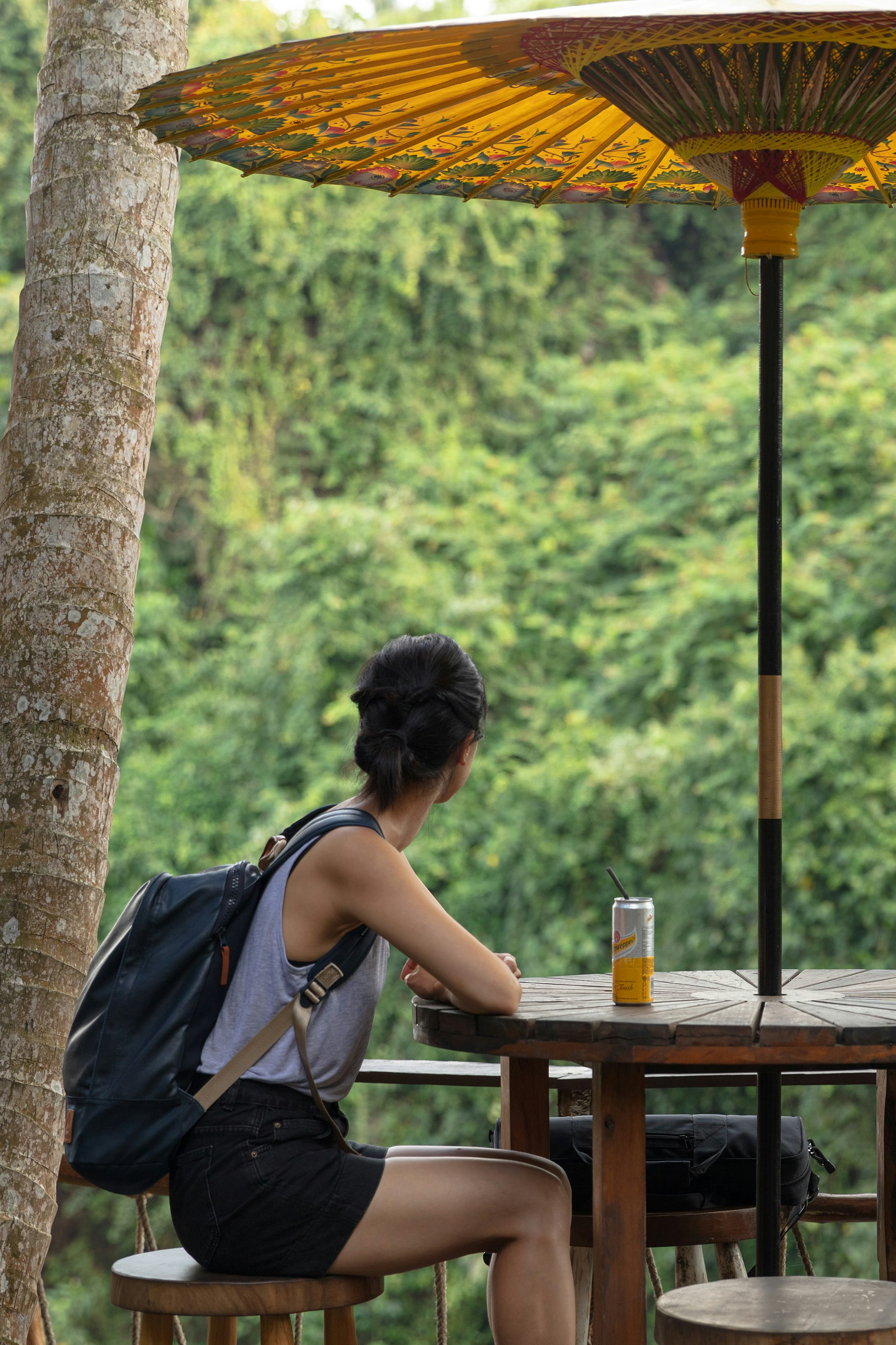 woman sitting at patio table